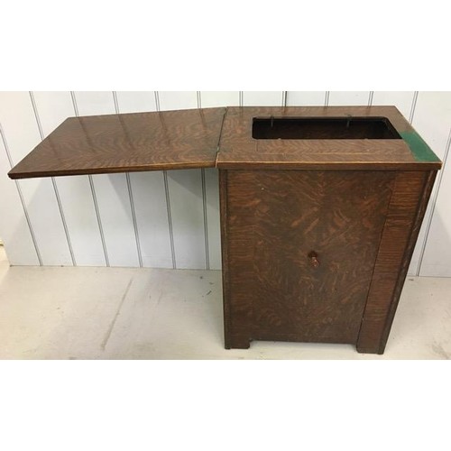 23C - An antique sewing machine cabinet.
Dimensions(cm) H79, W56/113, D42.