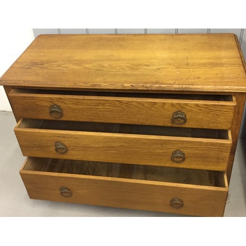 79 - A vintage oak chest of three drawers. Dimensions(cm) H66, W99, D45.