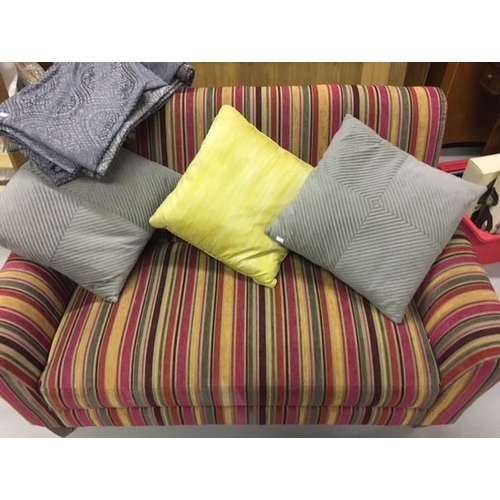 136 - A contemporary two-seater sofa, upholstered in multi-coloured, striped fabric, together with complim... 