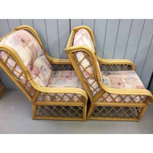 140 - A pair of matching bamboo & cane conservatory chairs. Dimensions(cm) H100(40 to seat), W72, D90.