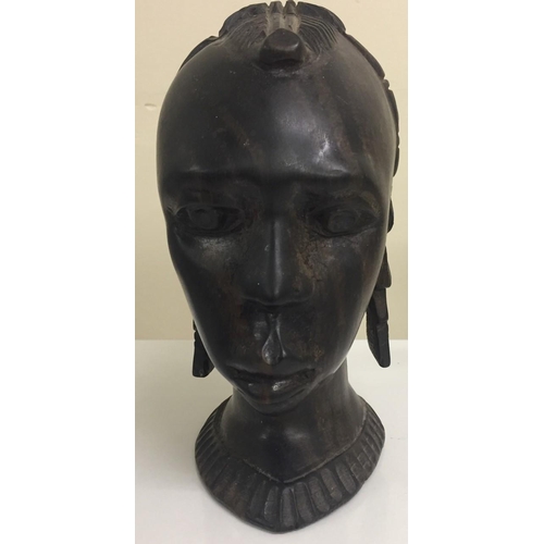 661C - A tribal-head wood carving. Height 20cm.