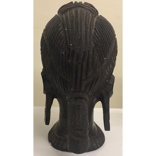 661C - A tribal-head wood carving. Height 20cm.