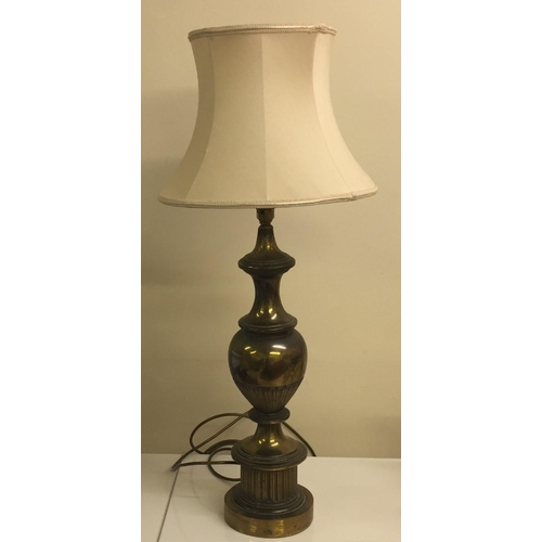 788 - A large brass lamp, with cream shade. Height 80cm