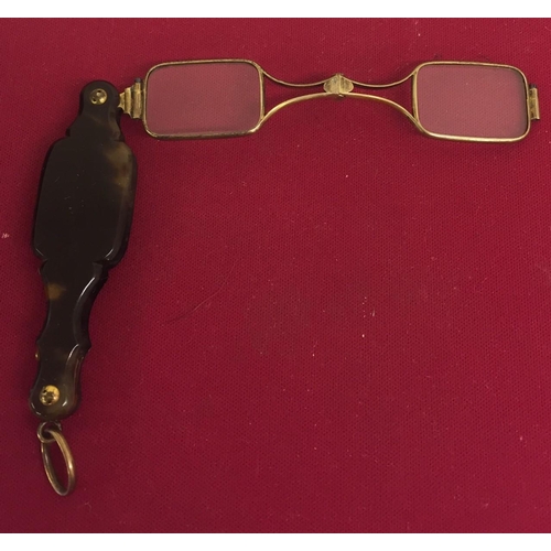 418 - A pair of 18ct gold, Victorian Lorgnette folding glasses. Spring in good working order.