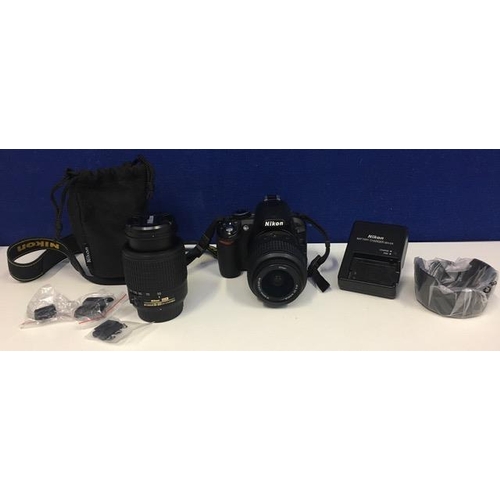 272 - A Nikon D3100 digital SLR camera. Complete with battery, charger, 18-55mm standard lens & 55-200mm z... 