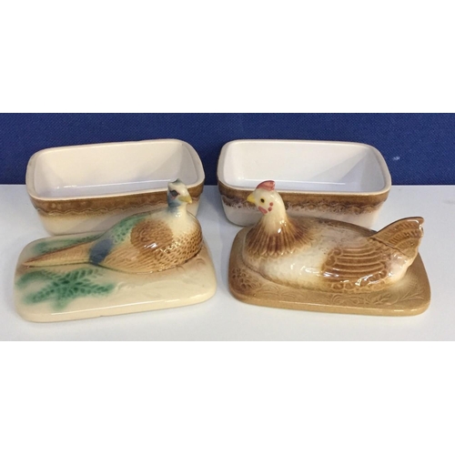 493 - Two lidded ceramic pate/pie dishes, depicting a partridge & pheasant. Dimension(cm) W18/16, D12/13.