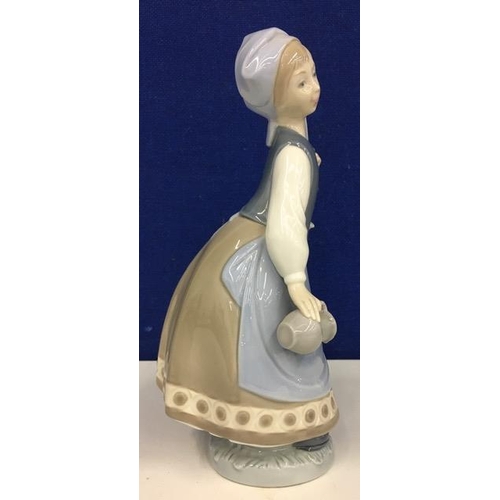 556 - A Lladro lady with basket & jug figurine. Retired 1985. Height 23cm.