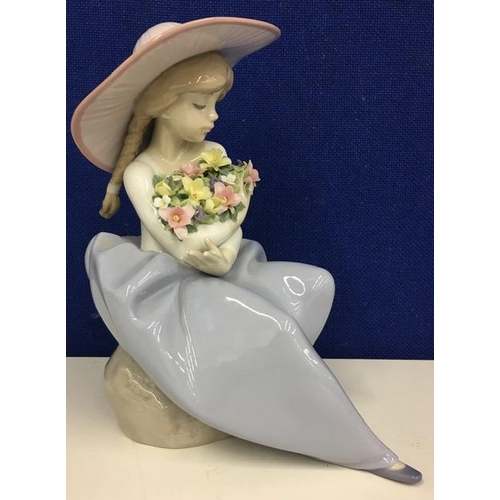 557 - A Lladro 'Fragrant Bouquet' Figurine. Height 20cm.