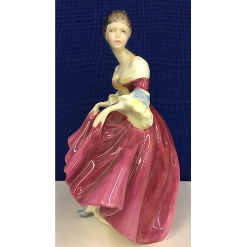 561 - A Royal Doulton 'Southern Belle' figurine. Height 20cm.