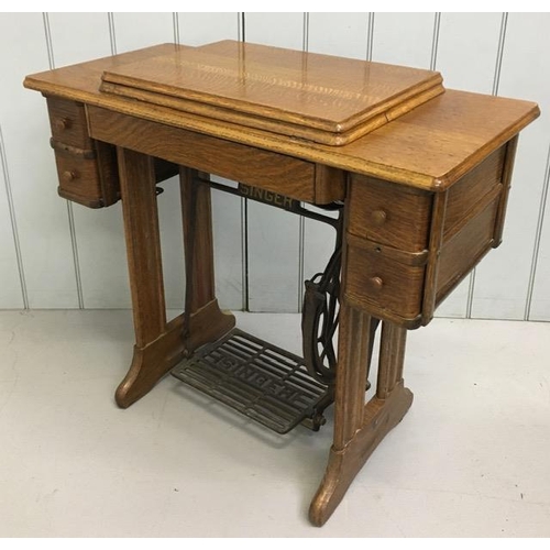 87 - A Singer treadle sewing machine table with sewing machine, accessories & original instruction manual... 