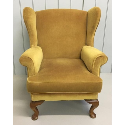 150 - A vintage, wingback fireside armchair, upholstered in gold coloured fabric. Dimensions(cm) H90(44 to... 