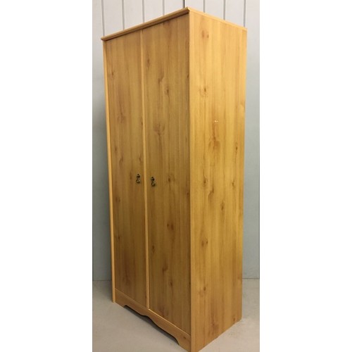 52 - A pine coloured, contemporary double wardrobe.
Dimensions(cm) H184, W79, D48.