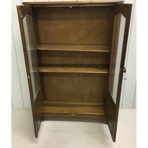 47 - An Edwardian, oak glazed bookcase. Three shelves. Key present. Dimensions(cm) H138, W92, D30.