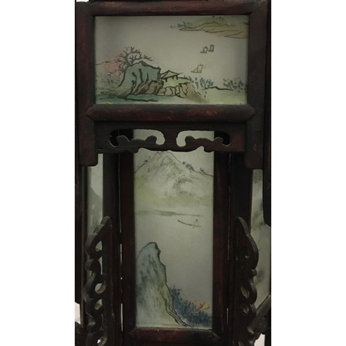 692 - An early 1900's Chinese Lantern. Hexagonal shaped, with twelve individually illustrated glass panels... 