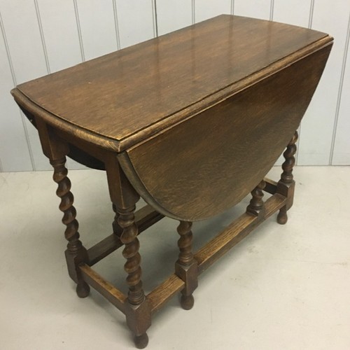 1 - An Edwardian oak gateleg table, with barley twist legs. Dimensions(cm) H74, W40/117, D90.