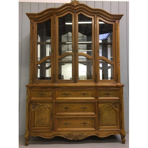 35 - A large, walnut-veneered display cabinet. Glazed/shelved cupboard over five drawers/double cupboard ... 