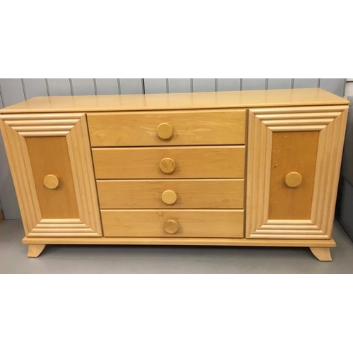 48 - A contemporary, Art-Deco style sideboard. Two shelved cupboards with four central drawers. Dimension... 