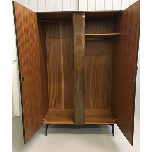 49 - A mid-century double wardrobe, by Meredew. Full & short length hanging rails, supported by splayed l... 