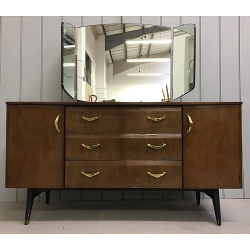 57 - A mid-century dressing table by Meredew. Tri-fold mirror over two cupboards, aside triple drawers. D... 