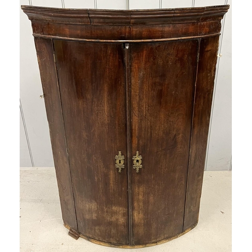 84 - An antique, mahogany, wall-hanging corner cabinet. Dimensions(cm) H104, W70, D46.