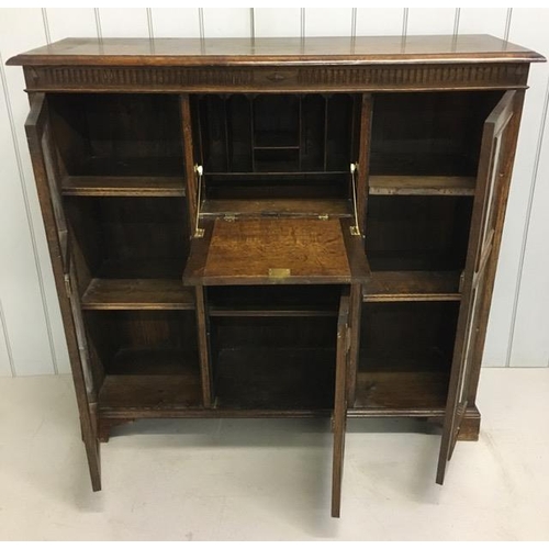 109 - An Edwardian oak, part glazed bureau. Key present. Dimensions(cm) H118, W128, D41.