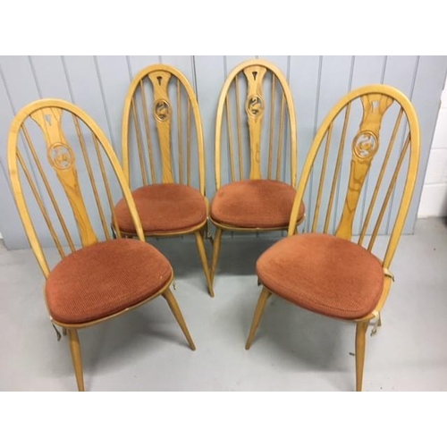 118 - A beautiful set of four Ercol, elm & beech, Swan-backed dining chairs. Complete with original, remov... 