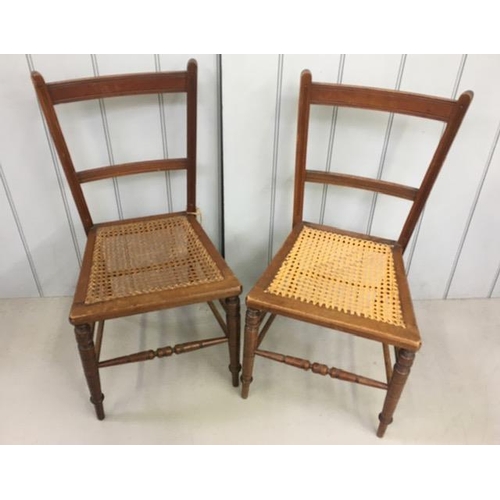 153A - A pair of cane-seated, occasional chairs. Dimensions(cm) H83(44 to seat), W39, D34.