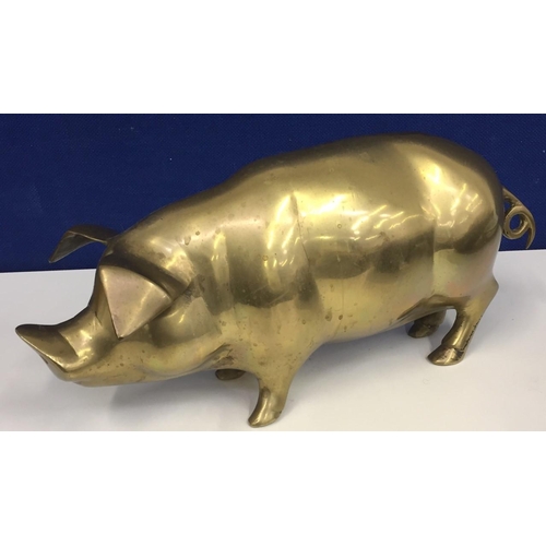 455 - A vintage brass model pig. Height 16cm, length 38cm.