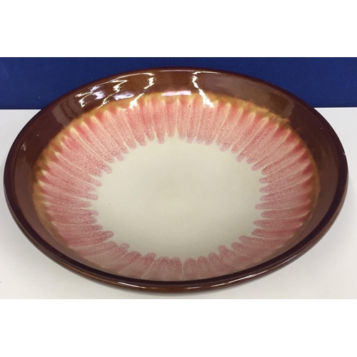 529 - A large circular, pottery bowl. Brown & pink glazed decoration.  Diameter 40cm.