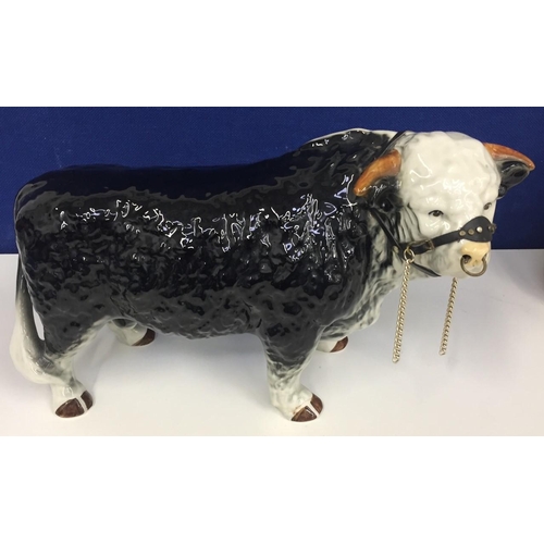 531 - A Nelson Pottery, black bull figure with nose ring. Shows sign of repair on front foot. 42cm x 26cm.