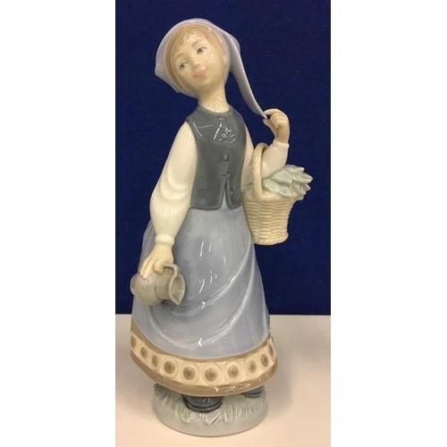 556 - A Lladro lady with basket & jug figurine. Retired 1985. Height 23cm.