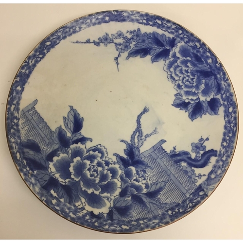 562 - A large Japanese blue & white Meiji charger. 1868-1912. Diameter 46cm.