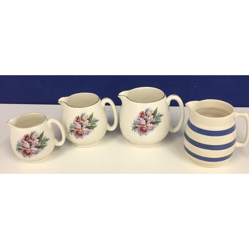 581 - A trio of floral ribbed, graduated Beswick jugs, together with a Staffordshire jug.