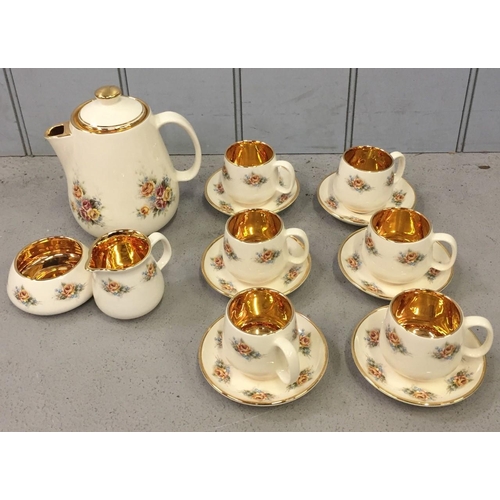 600 - A Prinknash Pottery floral tea set. Includes six cups & saucers, teapot, milk jug & sugar bowl.