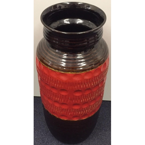 610 - A vintage, brown & red, West German Bay Pottery cylinder vase. Height 45cm.