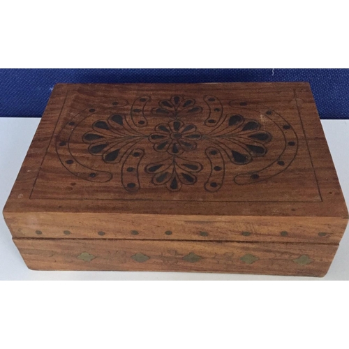 663 - A pretty wooden box, decorated with brass inlaid flowers. Dimensions(cm) H7, W21, D14.