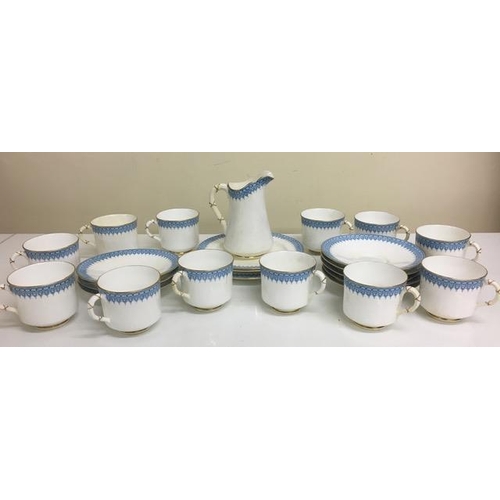 512 - A vintage, Royal Worcester part-tea service. Includes 12 teacups, 8 saucers, 3 side plates & milk ju... 