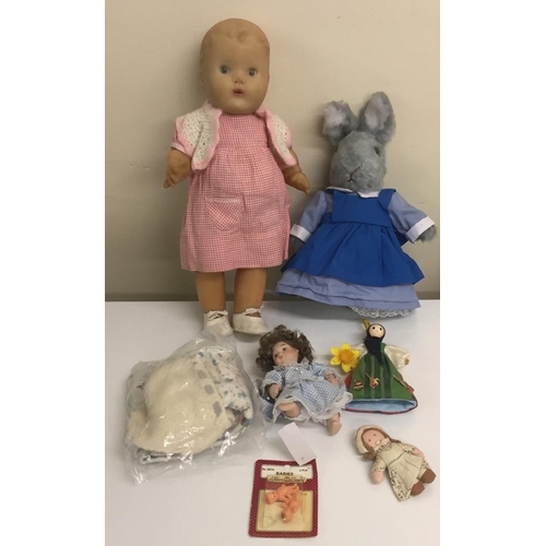 750 - A vintage, Pedigree 40cm rubber doll, in Gingham dress & spare clothes, together with a soft toy rab... 