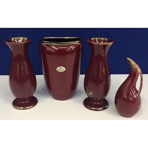 555 - A matching set of three glazed vases & a jug.