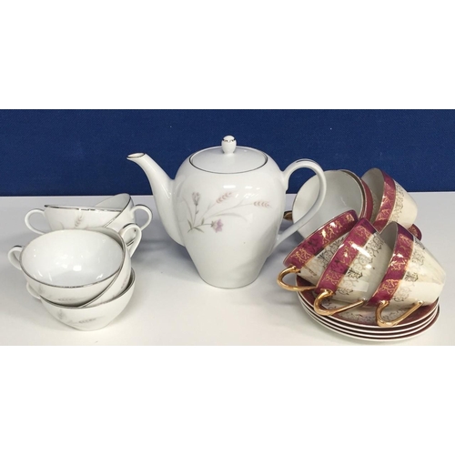 567 - A Japanese Jyoto teapot with 6 cups, together with 6 red/cream lustre cups & saucers.