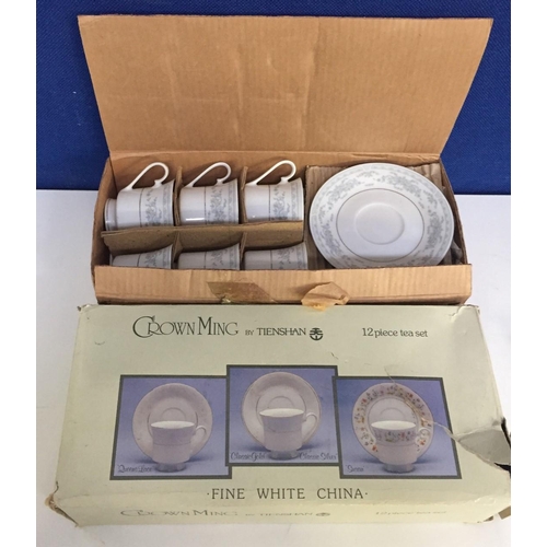 571 - A Tienshan Crown Ming 12 piece 'Rosepoint' tea set, in original box.