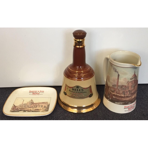 574 - A Wade Bells Scotch Whisky decanter, together with a Harvey & Son Brewers jug & plate, by Riverside ... 