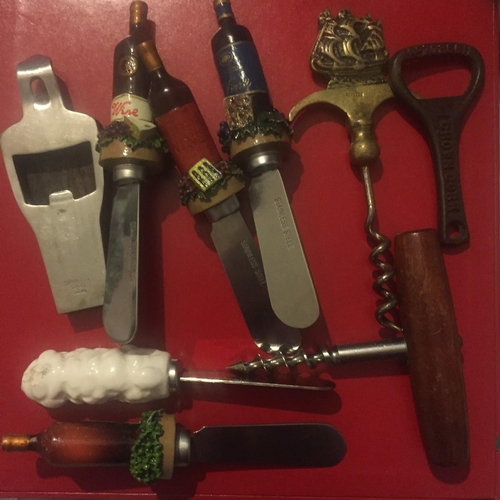 629 - A collection of vintage knives , corkscrews & bottle openers.