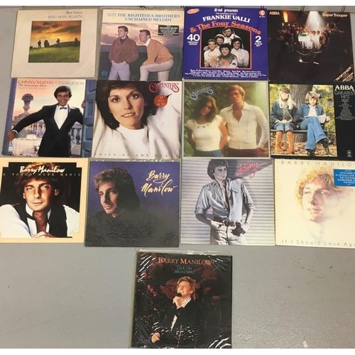 726 - A small collection of thirteen easy-listening vinyl LP's. Includes Abba, Barry Manilow, Frankie Vall... 