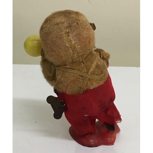 A vintage, clockwork monkey with maracas figure. Works intermittently.