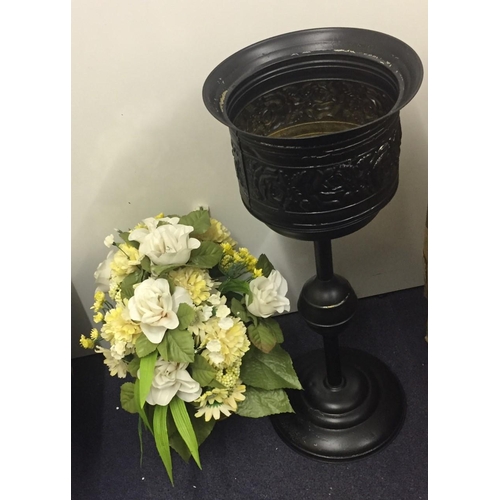 471 - A vintage metal planter, with dried flowers. Height 64cm.