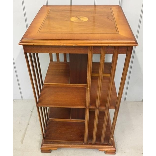 14 - A reproduction, Edwardian style, inlaid revolving bookcase. Dimensions(cm) H82, W48, D48.