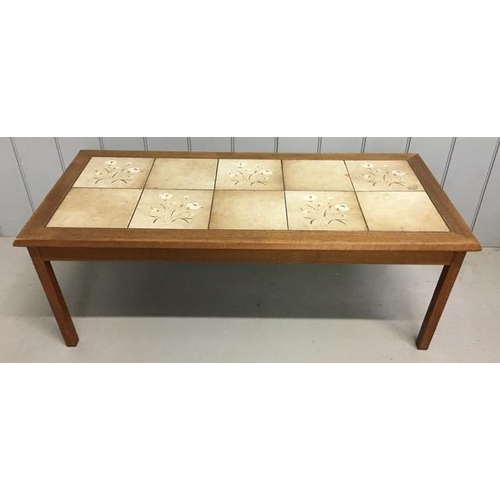 124 - A mid-century tiled coffee table, by Mobelfabrik. Slight chip to one tile. Dimensions(cm) H41, W112,... 