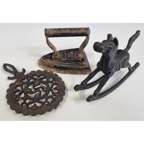 453 - A small quantity of metal ware, featuring a 'Silvester's patent' flat iron in size '4', a decorative... 