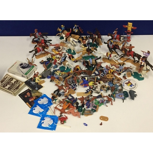 760 - A quantity of plastic Cowboys & Indians figures, together with two packs of playing cards.